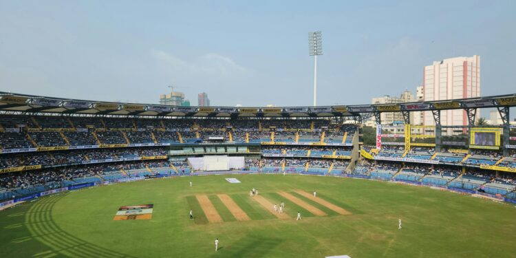 online casino, cricket stadium with players in the pitch