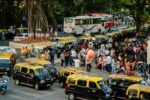 severe heatwave alert, moving crowd and taxi in mumbai