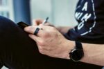 wearables - arm wearing smartwatch and smart ring
