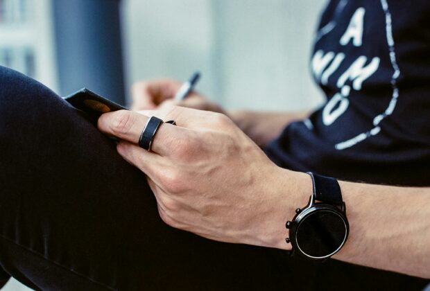 wearables - arm wearing smartwatch and smart ring