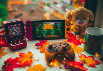 cozy games set up nintendo switch maple leaves, animal crossing stuffed toy