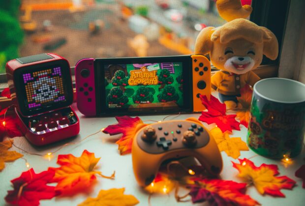cozy games set up nintendo switch maple leaves, animal crossing stuffed toy