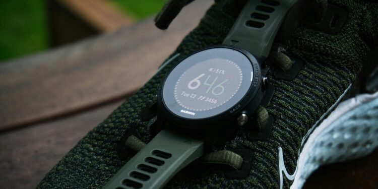 sports training and wearables, garman watch on shoe