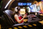 Woman Using Her Smartphone while Playing League of Legends Group Games