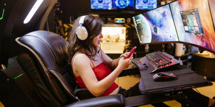 Woman Using Her Smartphone while Playing League of Legends Group Games