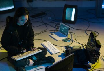 a woman typing on the keyboard for cybersecurity
