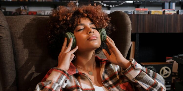 woman wearing headphones enjoying lossless audio