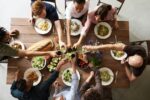 group of people making thanksgiving toast and thanksgiving wishes