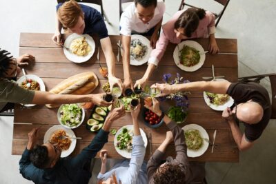 group of people making thanksgiving toast and thanksgiving wishes