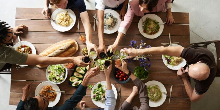 group of people making thanksgiving toast and thanksgiving wishes