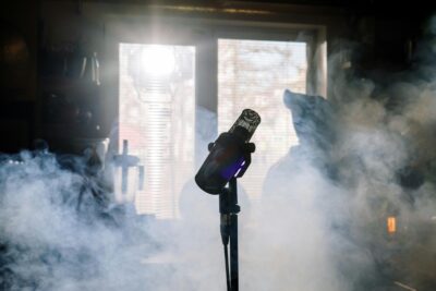 microphone with smoke behind it inspired by amy whinehouse and mark ronson working on back to black
