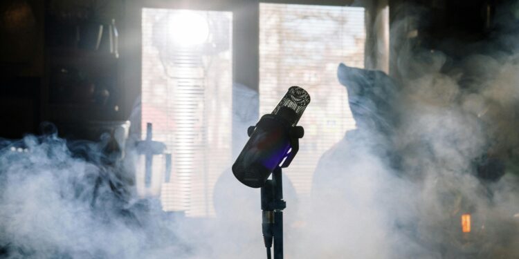 microphone with smoke behind it inspired by amy whinehouse and mark ronson working on back to black