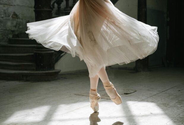 Woman in white skirt and ballet flats