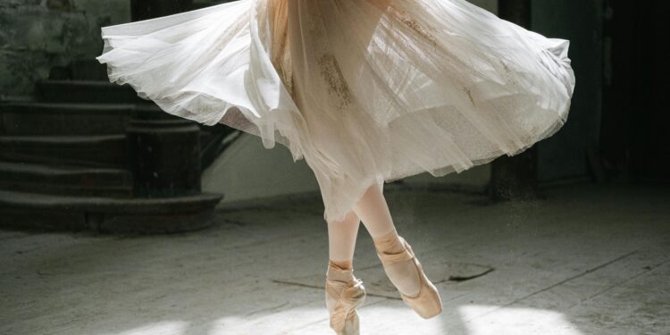 Woman in white skirt and ballet flats