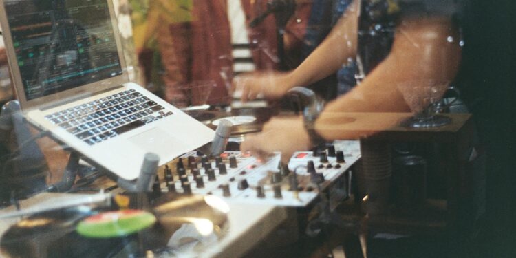 person using audio mixer controller like nujabes