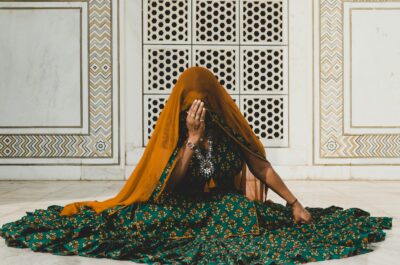 woman sitting on the floor wearing anarkali dress