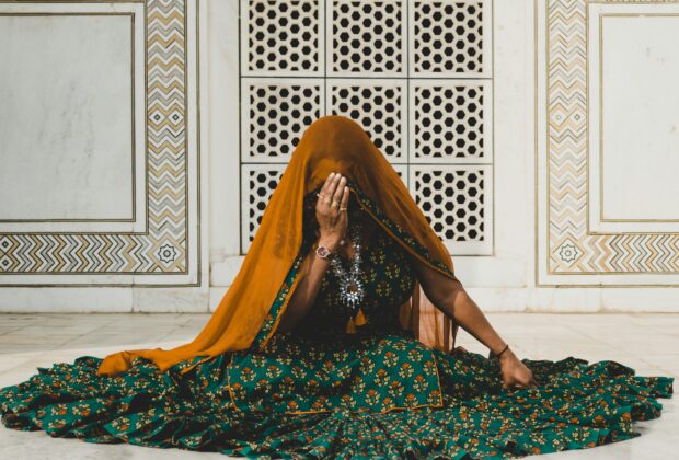 woman sitting on the floor wearing anarkali dress