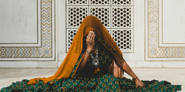 woman sitting on the floor wearing anarkali dress