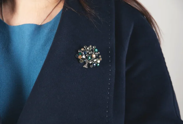sample of vintage brooches on woman's coat
