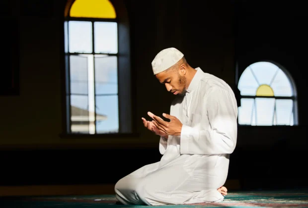 man observing islamic prayer times