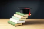 mptaas scholarship guide, stack of books with a graduation cap
