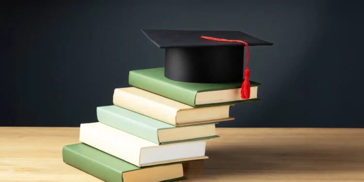 mptaas scholarship guide, stack of books with a graduation cap